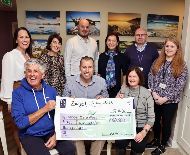 Donegal Cmaino walkers Noel Cunnigham, Noreen D'arcy, Peggie Stringer and Deirdre Mc Gloin presenting a check for €50,500 to Cancer Care West team members Richie Flahery and Grainne Mc Gettigan, Dave O'Donnell and Patrica Doherty