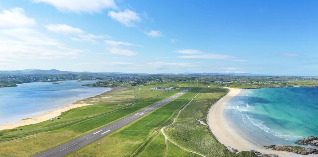Donegal Airport runway on a clear, sunny day, featuring two beaches on either side